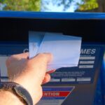 Putting letters in an outdoor metal mailbox